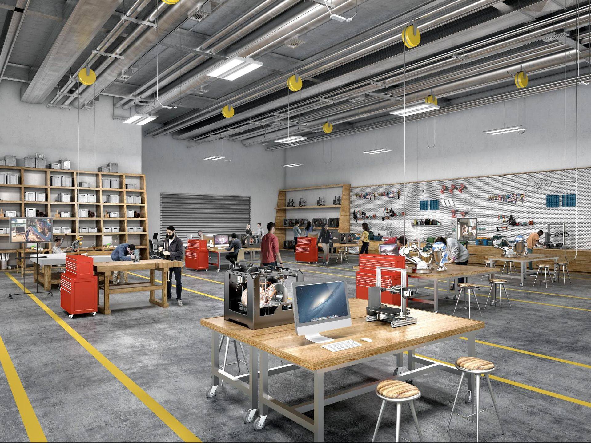 The East End Maker Hub Studio showcases a vast open space adorned with desks and tables